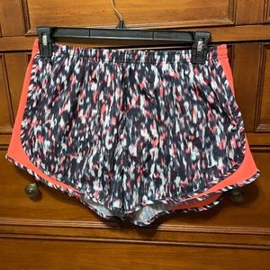 Black and pink athletic Nike shorts